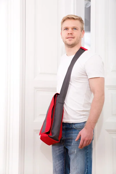 Young man coming home — Stock Photo, Image